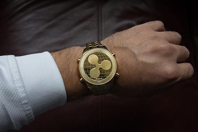 Picture of a wristwatch with the Ripple icon to accompany a blog post about a Ripple class action