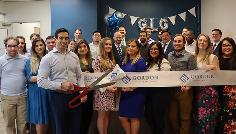 Gordon Law Group team celebrating our new Skokie office in 2022!